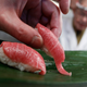 A sushi chef serves sushi of high-quality fatty Atlantic bluefin tuna or "o-toro sushi nigiri" at a sushi restaurant in Tokyo March 18, 2010.